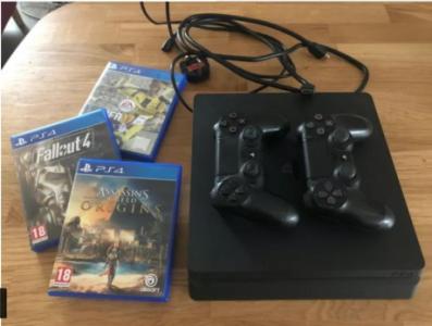 PS4 Slim 500GB with 2 controllers and 3 games